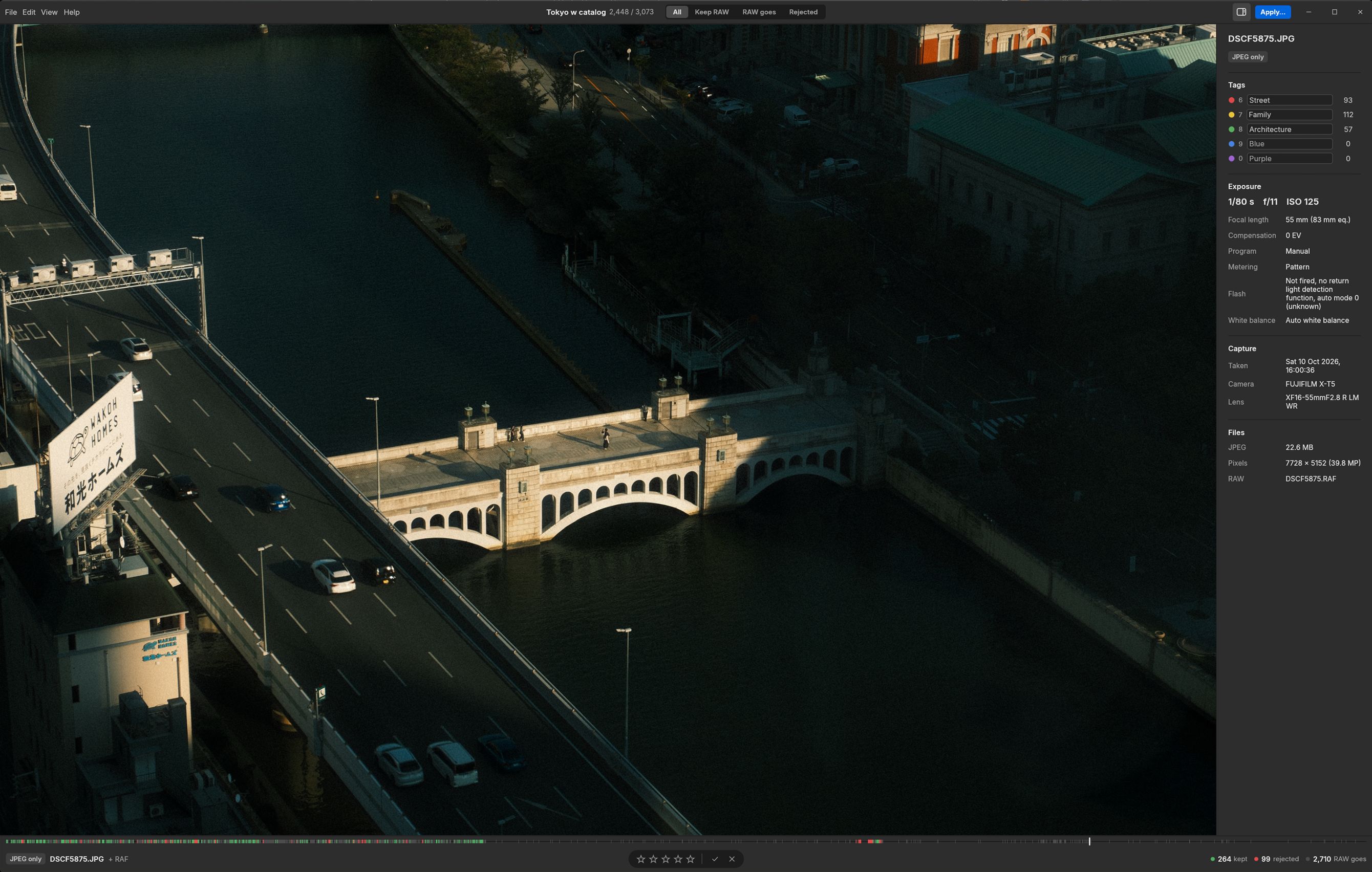 Rawpeg showing a bridge over a river at dusk, with the info sidebar listing tags, exposure, capture and file details.